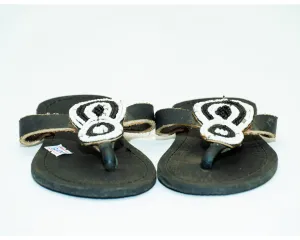 Crafted leather sandals with white and black beads
