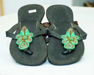 Crafted leather sandals with green beads